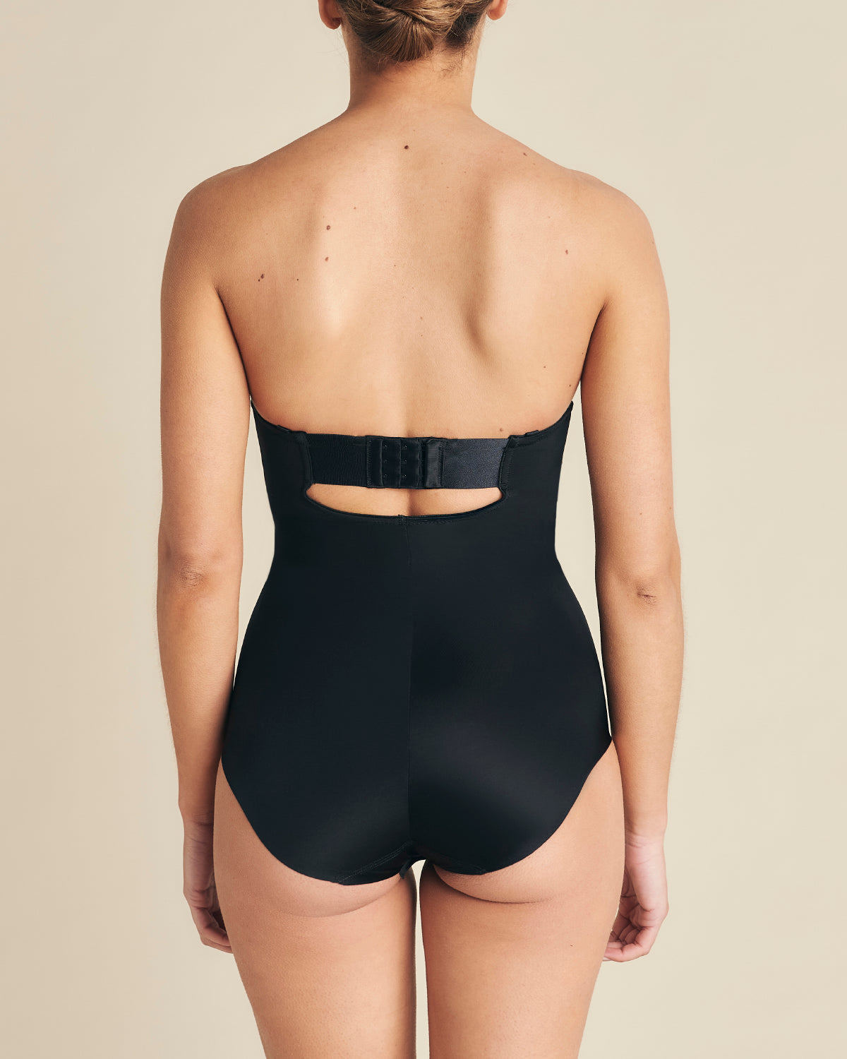 Black Strapless Slimming Bodysuit by SPANX